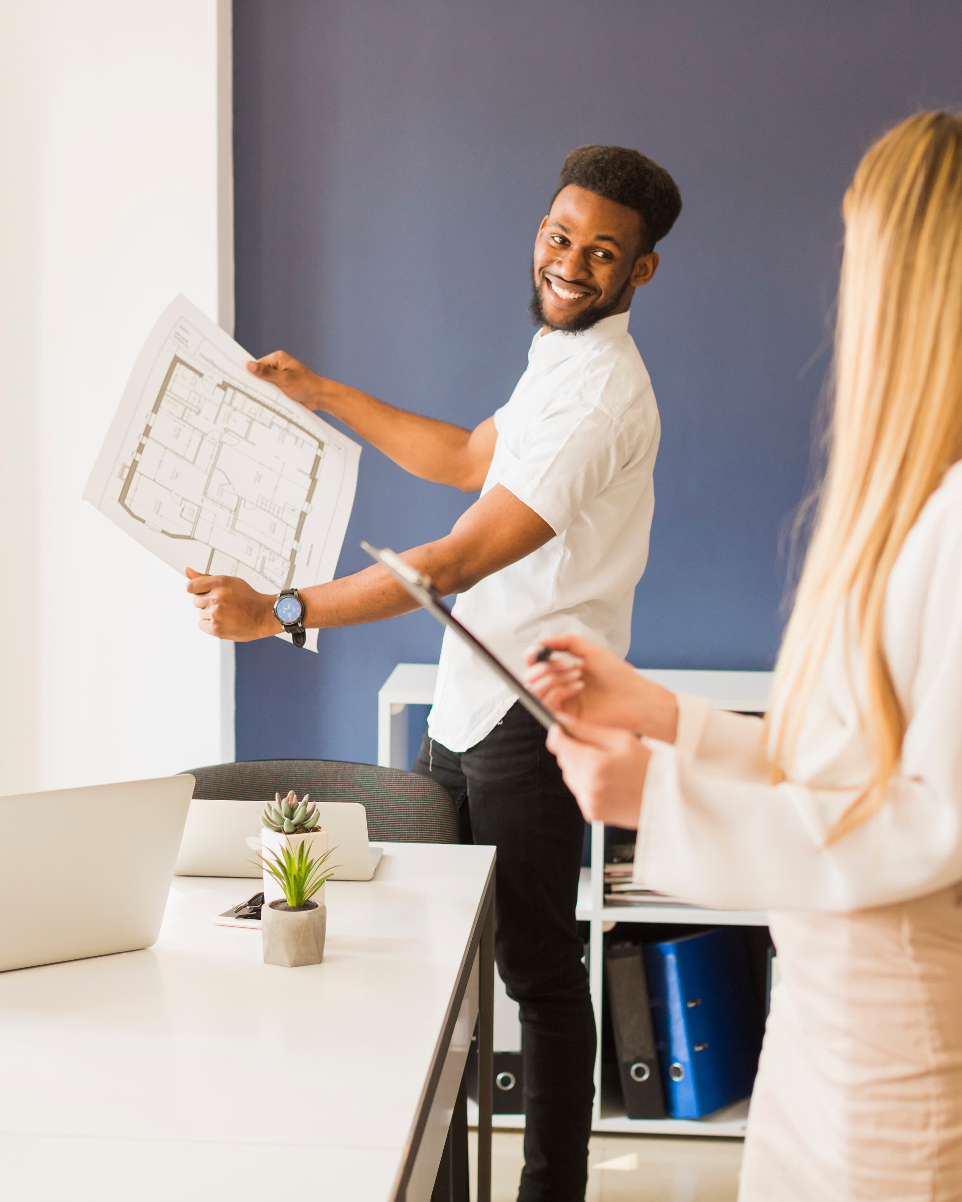 Service provider reviewing a building plan